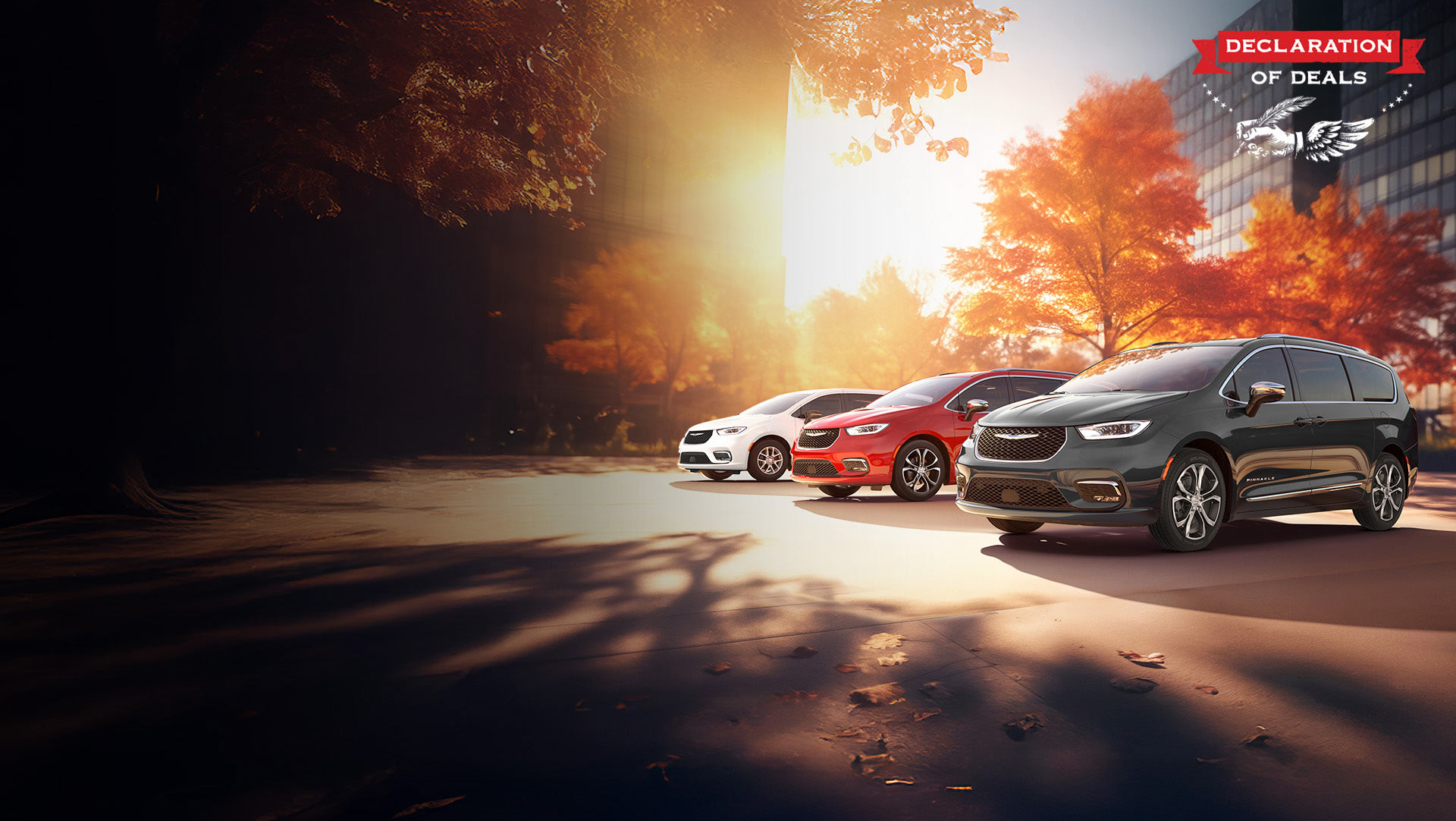 Tres modelos de la minivan Chrysler 2026 estacionados en una playa junto al mar. De izquierda a derecha: Chrysler Voyager blanca, Pacifica Pinnacle Plug-in Hybrid azul y Pacifica Pinnacle roja. Evento de ventas Declaración de ofertas.